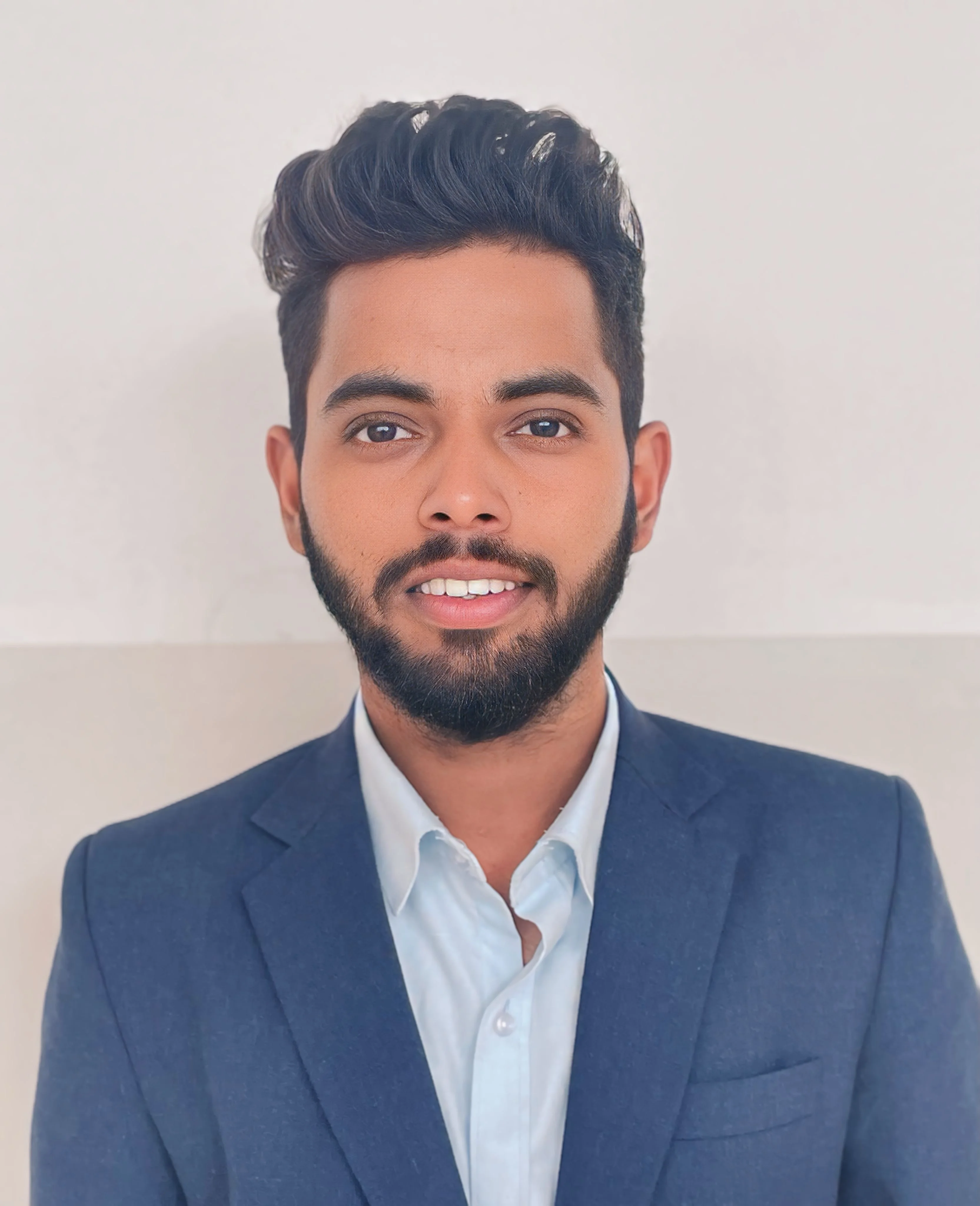 Portrait of man Ninal Gordon with glasses and casual shirt in natural light